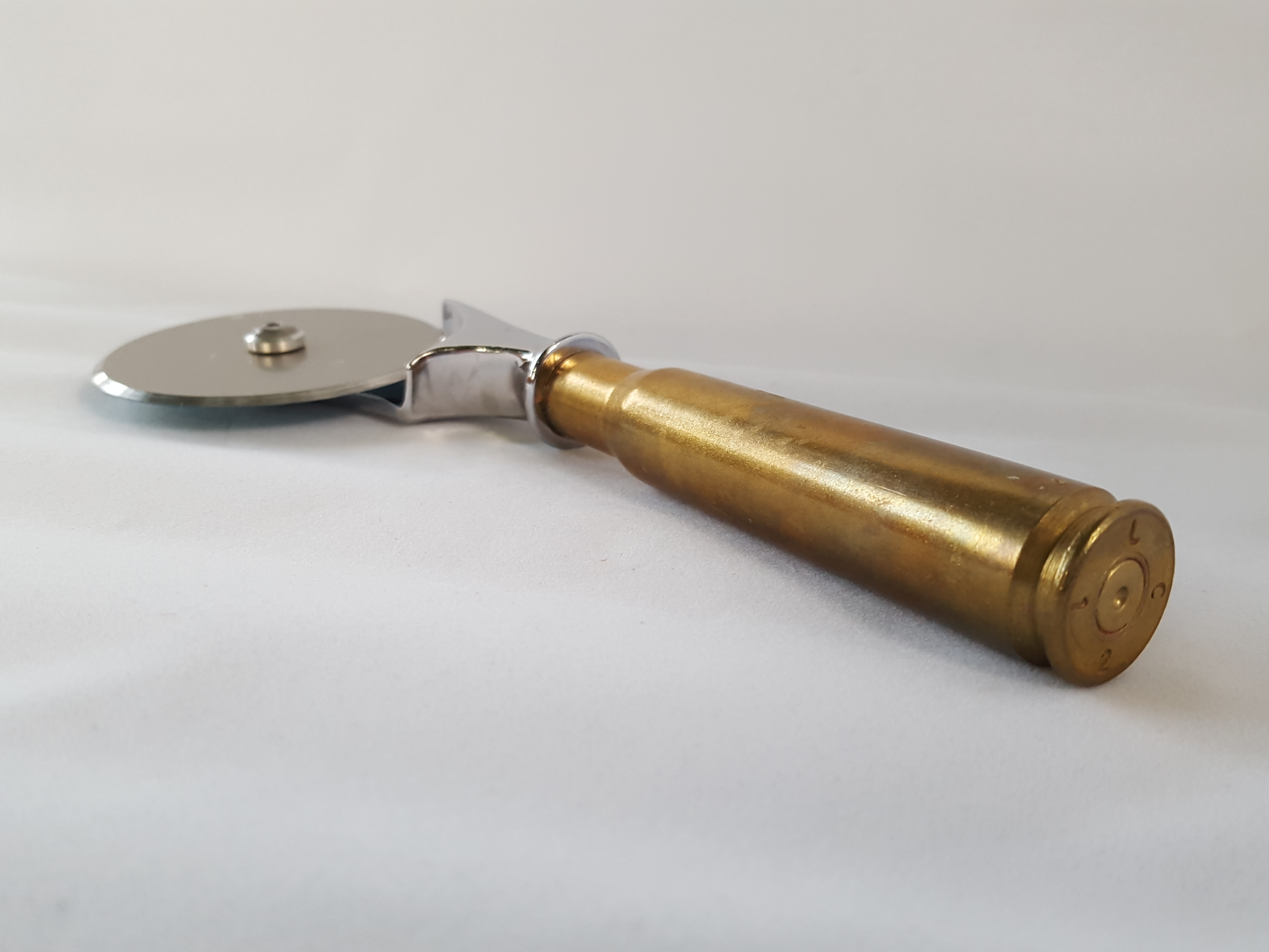 50 Caliber Pizza Cutter Sawdust and Bullets